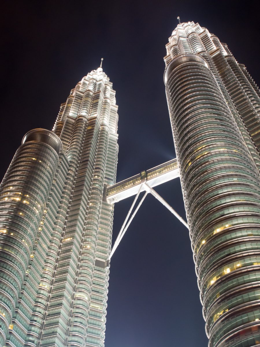 Petronas Towers lit at night from below