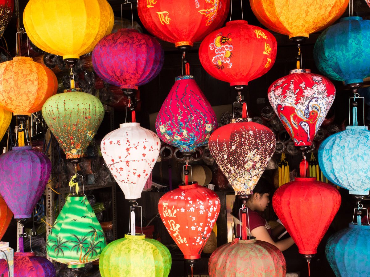 Colorful painted lanterns hanging in front of shop