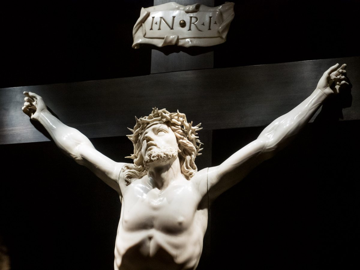 Statue of Jesus (white) on cross (black)