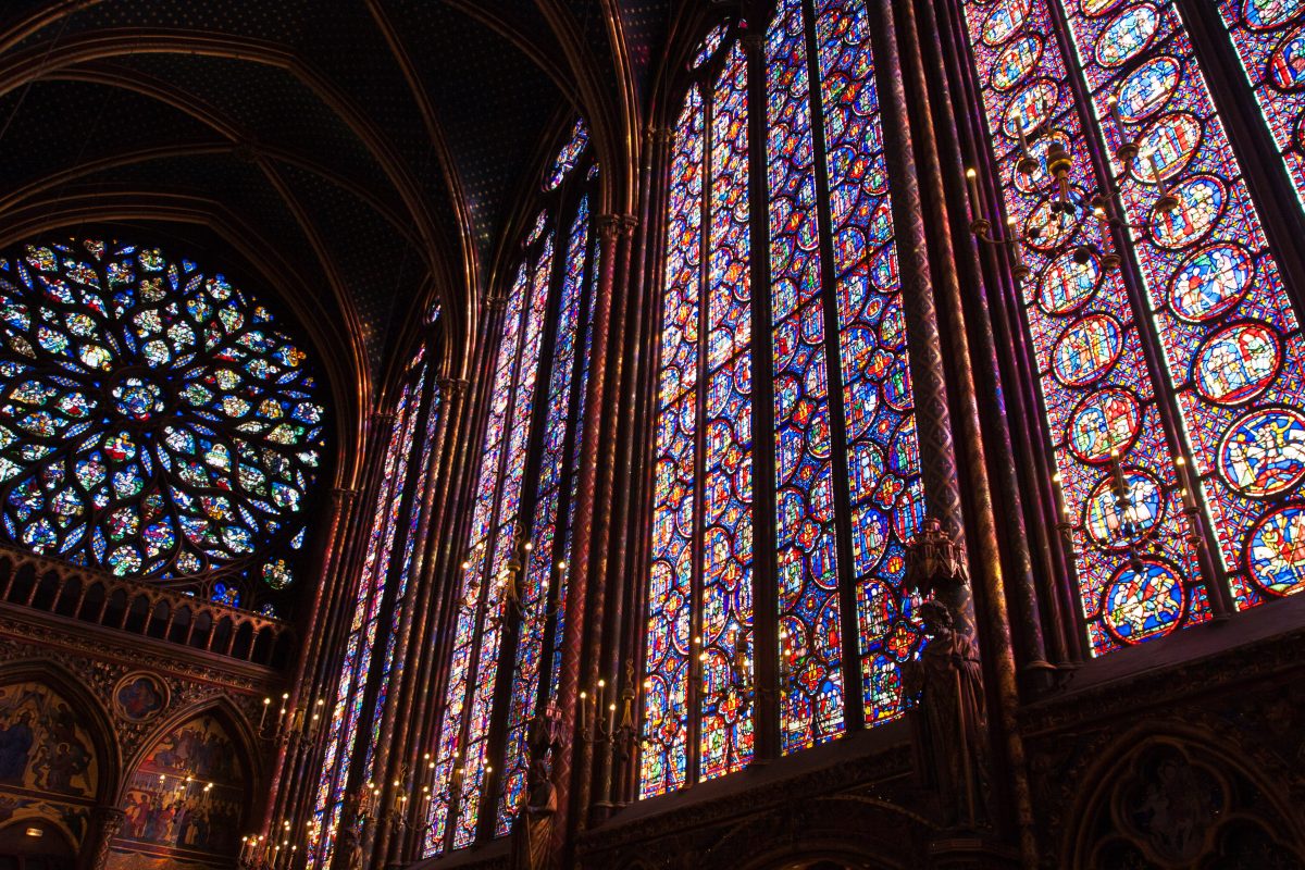 Large colorful stained glass windows in a gothic church