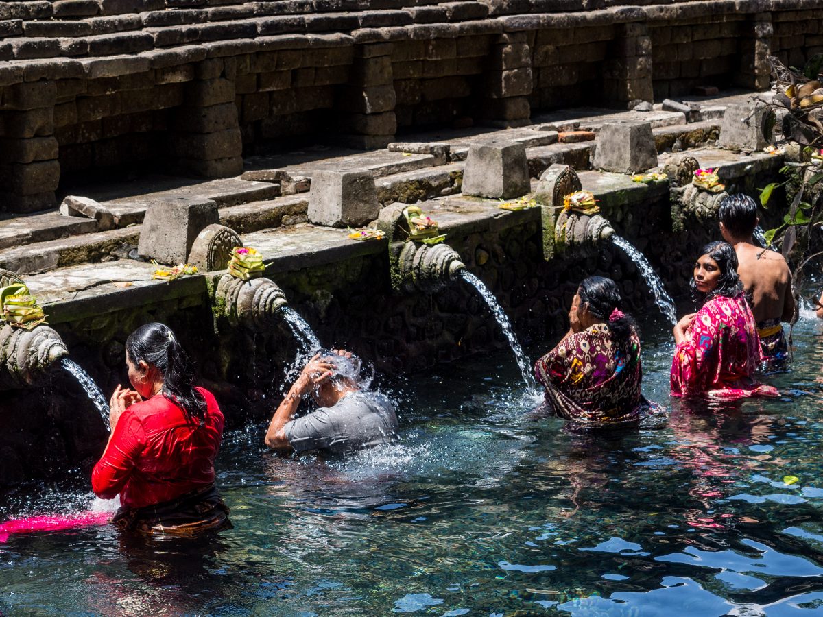 People bathing in sacred fountains